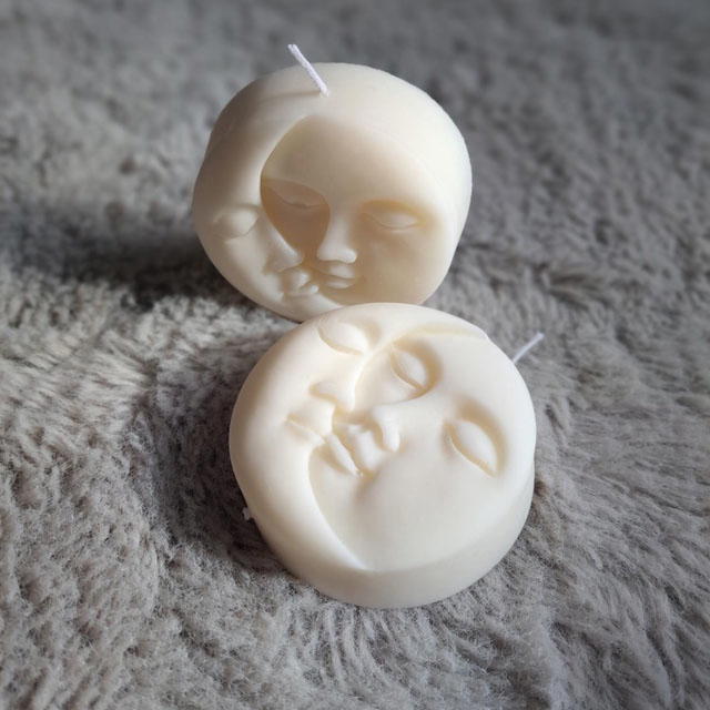 Beautiful Sun and Moon face candle.