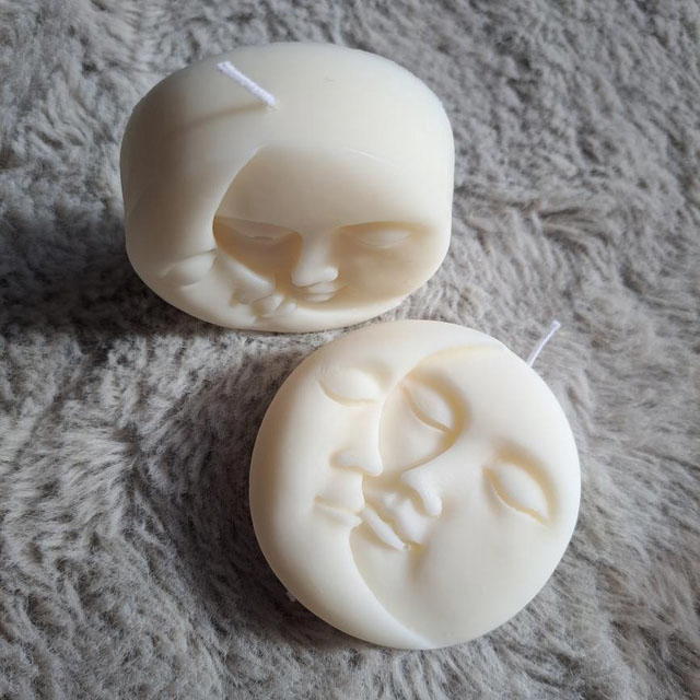 Beautiful Sun and Moon face candle.