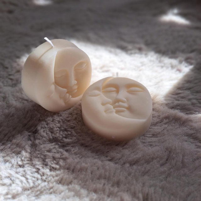 Beautiful Sun and Moon face candle.